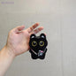 Black and white kitten keychain with big, cute eyes, cartoon plush pendant
