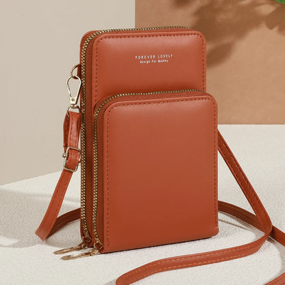 Modern, compact, and secure women's cell phone bag. Holds phones, cards, and documents