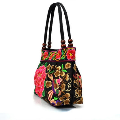 Small women's shoulder bag with floral embroidery, top handle, and flap with bead embellishments