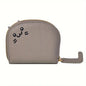 Card holder with a cat-shaped design and multiple compartments.