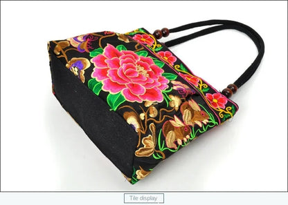 Small women's shoulder bag with floral embroidery, top handle, and flap with bead embellishments