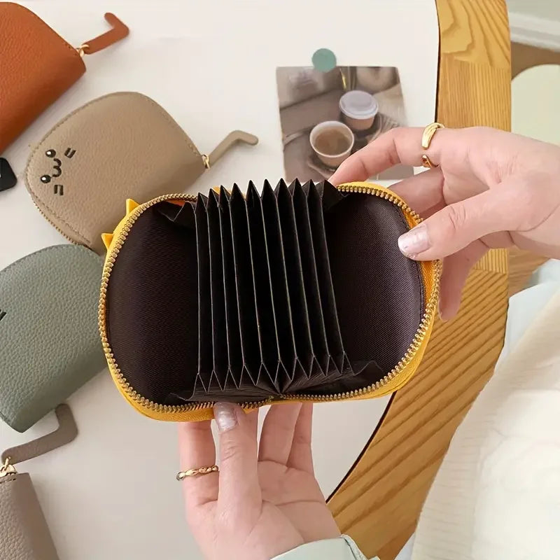 Card holder with a cat-shaped design and multiple compartments.