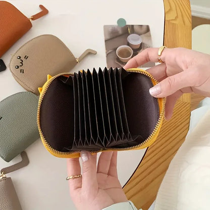 Card holder with a cat-shaped design and multiple compartments.