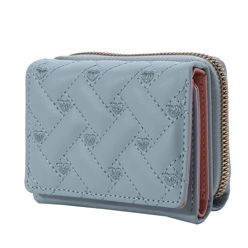 Small women's wallet in leather, elegant design, available in various colors.