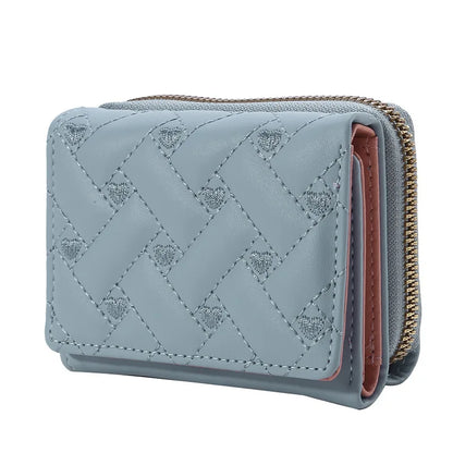 Small women's wallet in leather, elegant design, available in various colors.