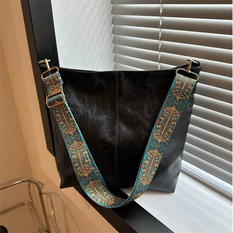 Women's bohemian-style handbag with vintage embroidery and a wide strap