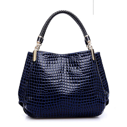 Women's satchel and tote bag with crocodile print and top handle. Stylish