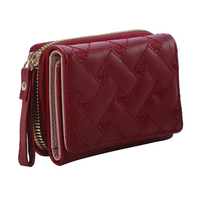 Small women's wallet in leather, elegant design, available in various colors.
