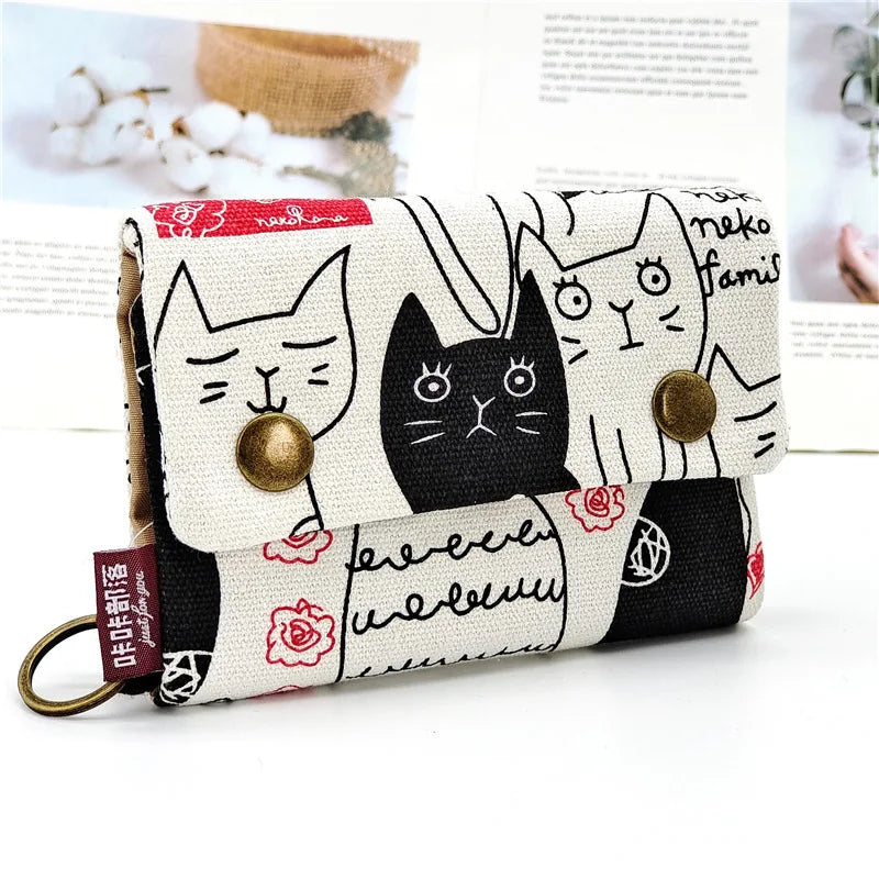 Women's wallet with cartoon print for girls, with key holder and coin purse in various designs.