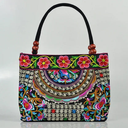 Small women's shoulder bag with floral embroidery, top handle, and flap with bead embellishments