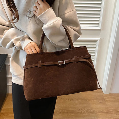 Women's handbag made of synthetic suede with a decorative buckle, large capacity, and snap closure