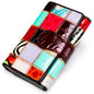 Elegant, compact women's wallet featuring a two-tone design, coin pocket, multiple card slots, and a money clip; crafted from high-quality genuine leather.