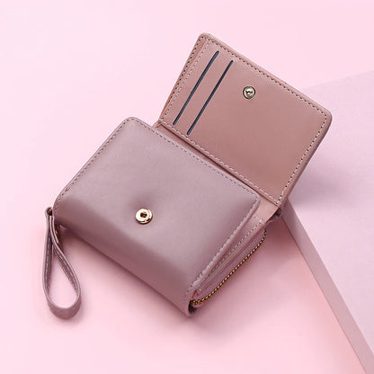 Small women's wallet in leather, elegant design, available in various colors.