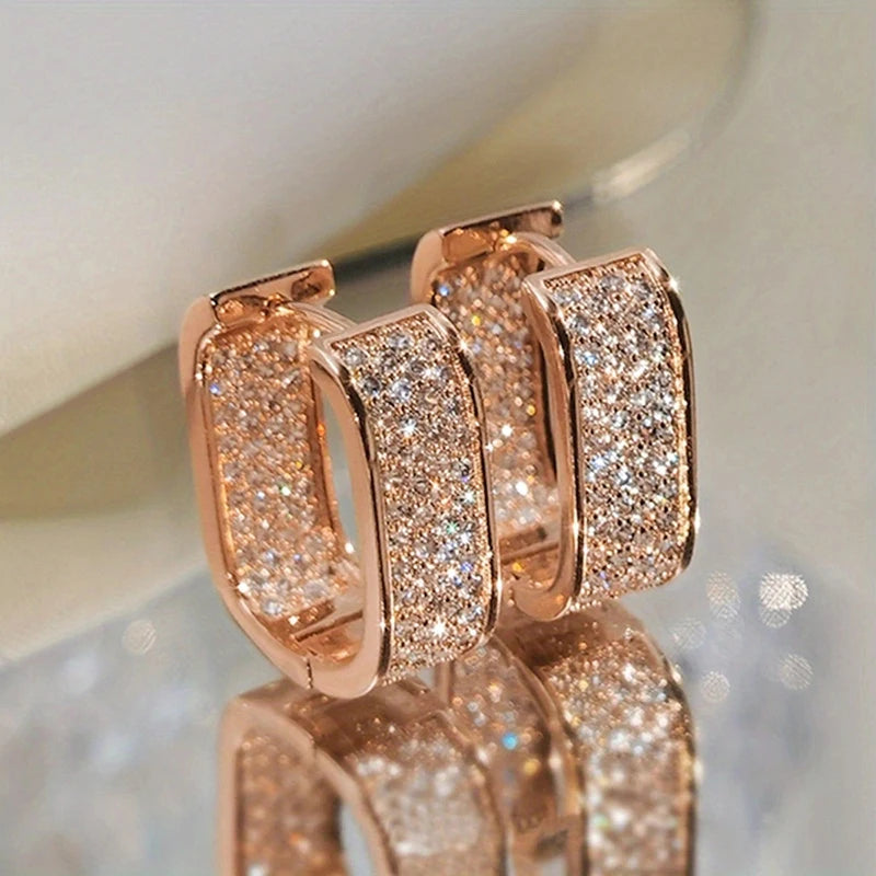 Women's silver or gold hoop earrings set with cubic zirconia