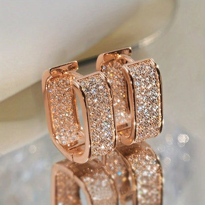 Women's silver or gold hoop earrings set with cubic zirconia