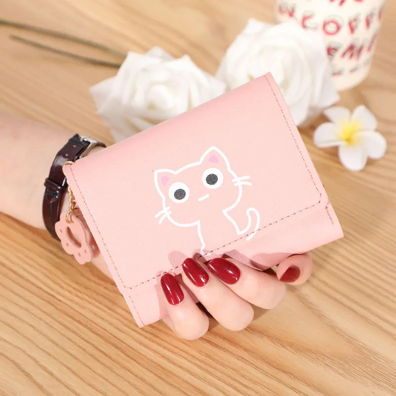 Small and compact women's wallet for girls with a cat print, featuring card slots and a bill compartment.