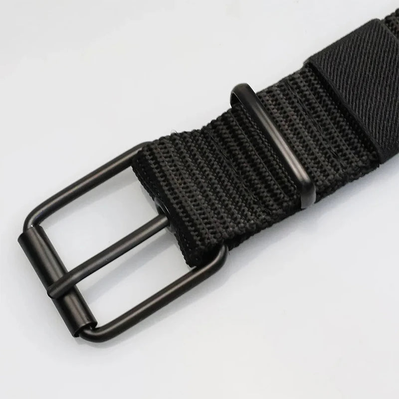 Unisex canvas belt with pin buckle and leather detail. Modern with eyelets and perfect for wearing with jeans.