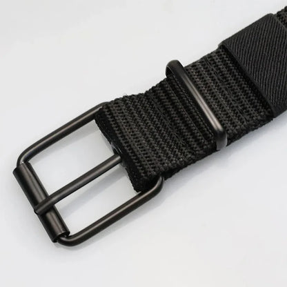 Unisex canvas belt with pin buckle and leather detail. Modern with eyelets and perfect for wearing with jeans.
