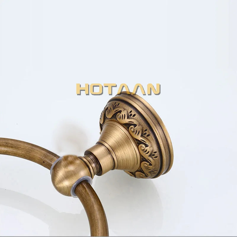 Round aluminum wall-mounted towel rack for bathrooms, with an antique brass finish.
