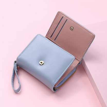 Small women's wallet in leather, elegant design, available in various colors.