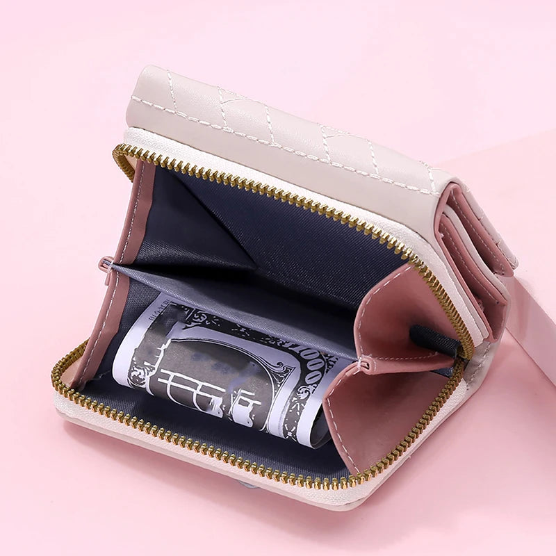 Small women's wallet in leather, elegant design, available in various colors.