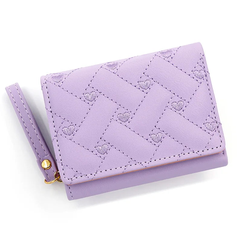 Small women's wallet in leather, elegant design, available in various colors.
