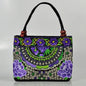 Small women's shoulder bag with floral embroidery, top handle, and flap with bead embellishments