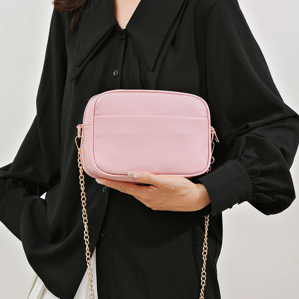 Women's leather tote bag, classic style with crossbody strap and chain detail
