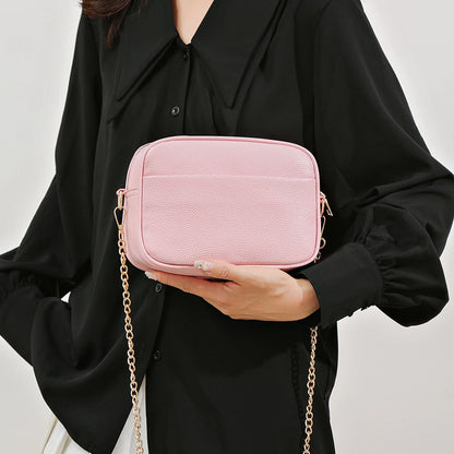 Women's leather tote bag, classic style with crossbody strap and chain detail