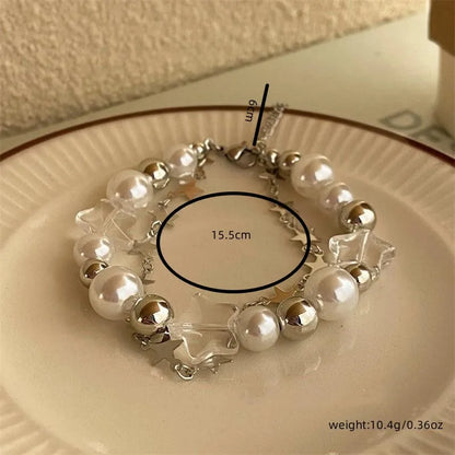 Adjustable bracelet with a double zinc alloy chain, featuring pearls and resin stars, ideal as a gift for girls. Beautiful, lightweight, and charming