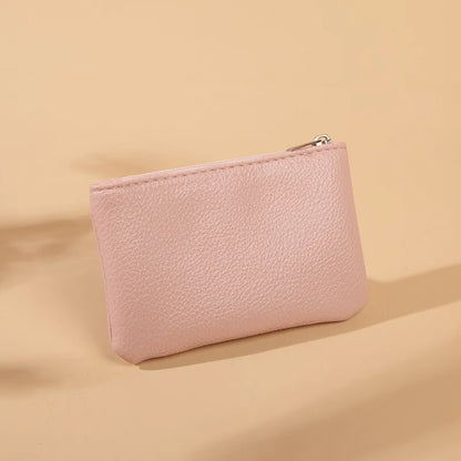 Small and elegant women's wallet with zipper closure, card holder and key holder