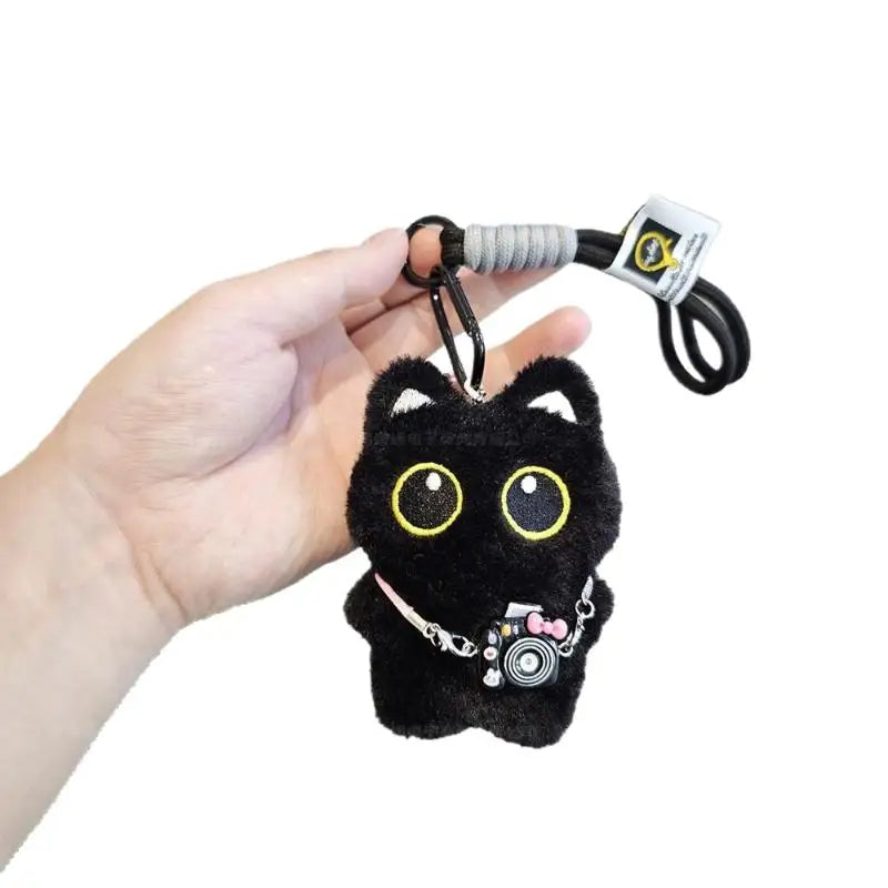 Black and white kitten keychain with big, cute eyes, cartoon plush pendant