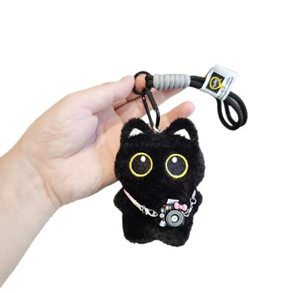 Black and white kitten keychain with big, cute eyes, cartoon plush pendant