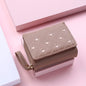 Small women's wallet in leather, elegant design, available in various colors.