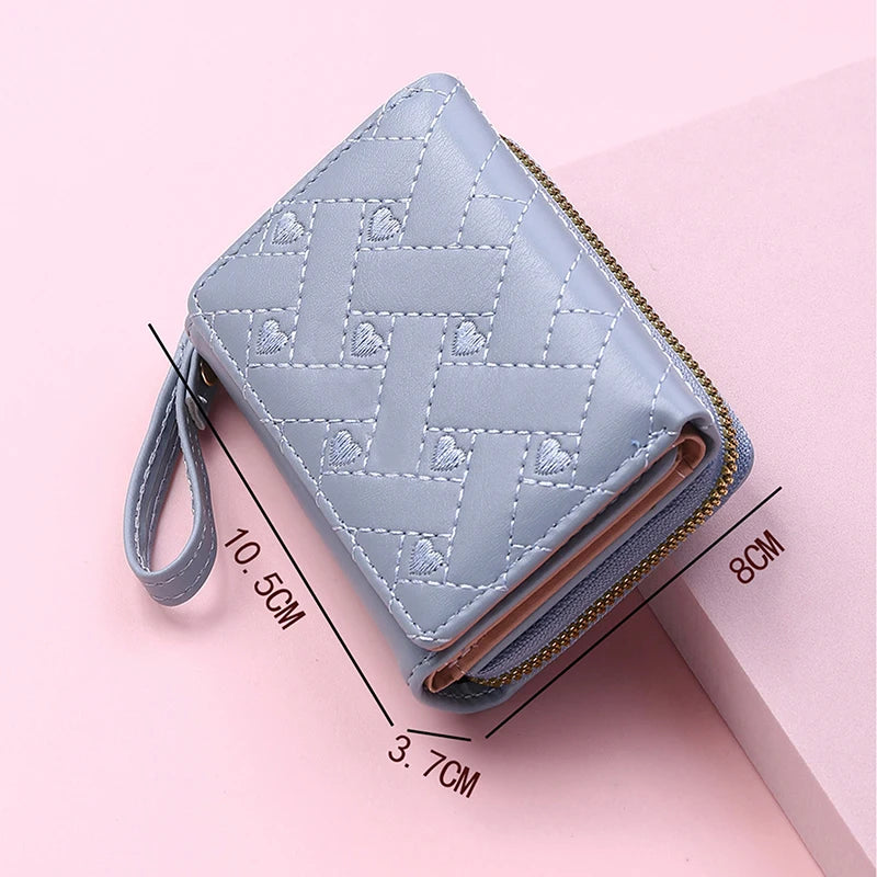 Small women's wallet in leather, elegant design, available in various colors.