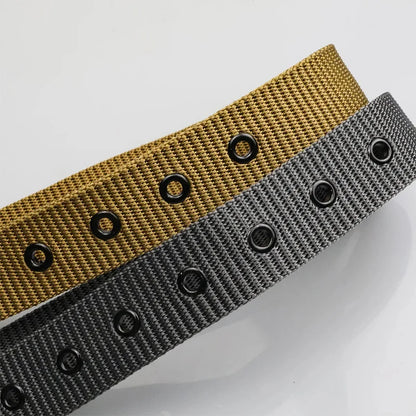 Unisex canvas belt with pin buckle and leather detail. Modern with eyelets and perfect for wearing with jeans.