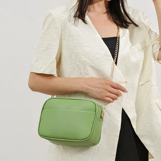 Women's leather tote bag, classic style with crossbody strap and chain detail