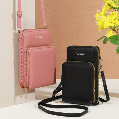 Modern, compact, and secure women's cell phone bag. Holds phones, cards, and documents