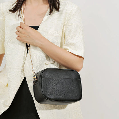 Women's leather tote bag, classic style with crossbody strap and chain detail