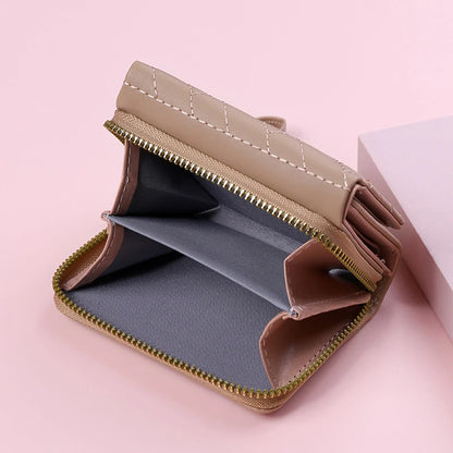 Small women's wallet in leather, elegant design, available in various colors.