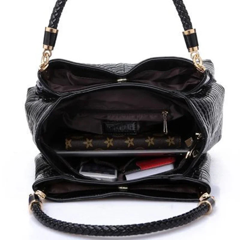 Women's satchel and tote bag with crocodile print and top handle. Stylish