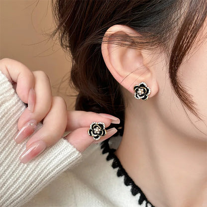 Black Camellia earrings with embedded cubic zirconia and rhinestones, modern and delicate