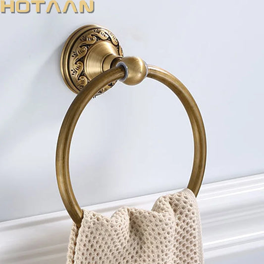 Round aluminum wall-mounted towel rack for bathrooms, with an antique brass finish.