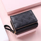 Small women's wallet in leather, elegant design, available in various colors.