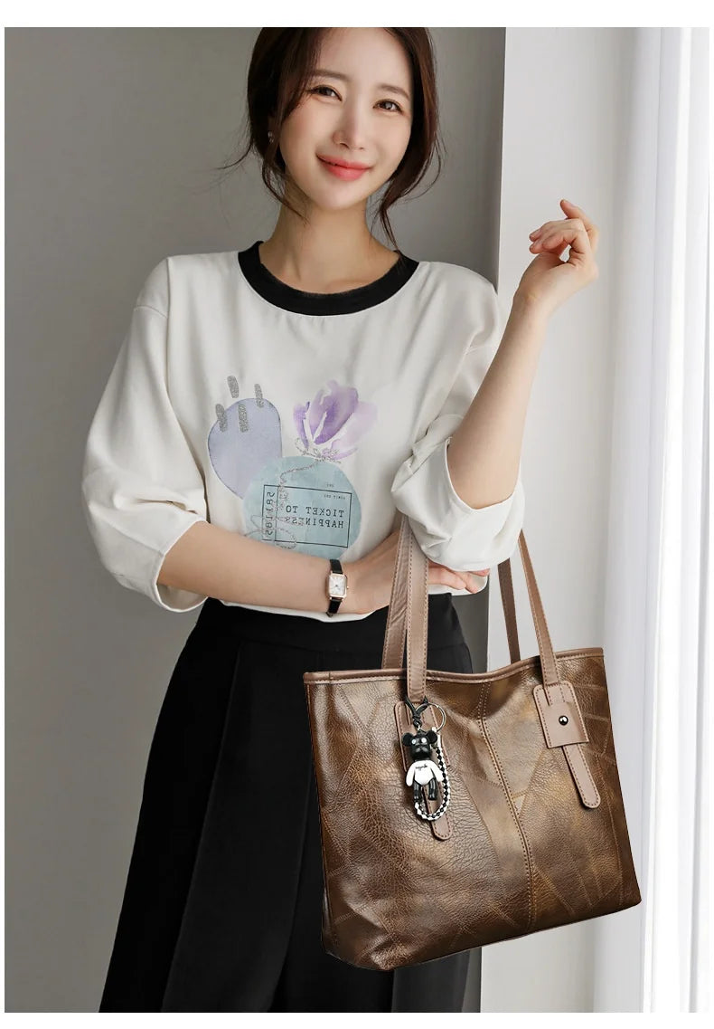Stylish and elegant women's square tote bag with a horizontal zipper, suitable for carrying by hand or on the shoulder