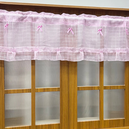 Short curtains made of pink checkered tulle and sheer voile for kitchen cabinets, doors, and windows.