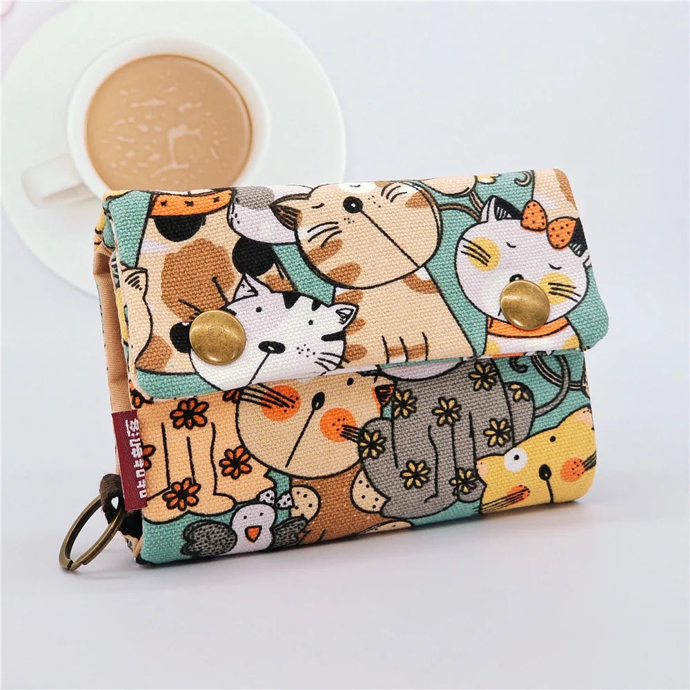 Women's wallet with cartoon print for girls, with key holder and coin purse in various designs.