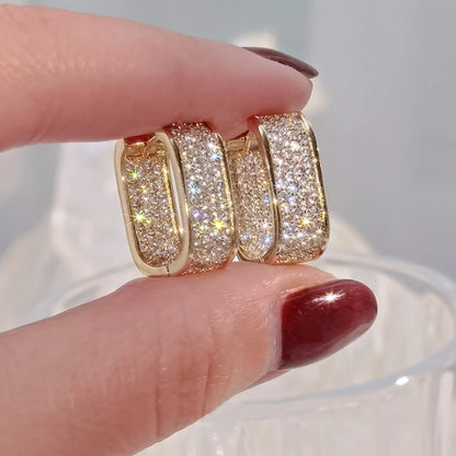 Women's silver or gold hoop earrings set with cubic zirconia