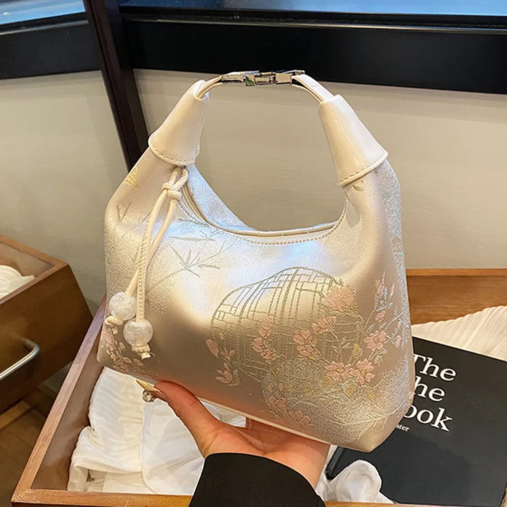 Women's embroidered handbag with zipper, made of silky fabric, adjustable strap