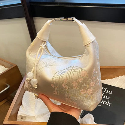 Women's embroidered handbag with zipper, made of silky fabric, adjustable strap
